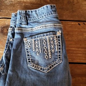 Rock & Roll cowgirl jeans. Trendy with accents on packets. 25x34